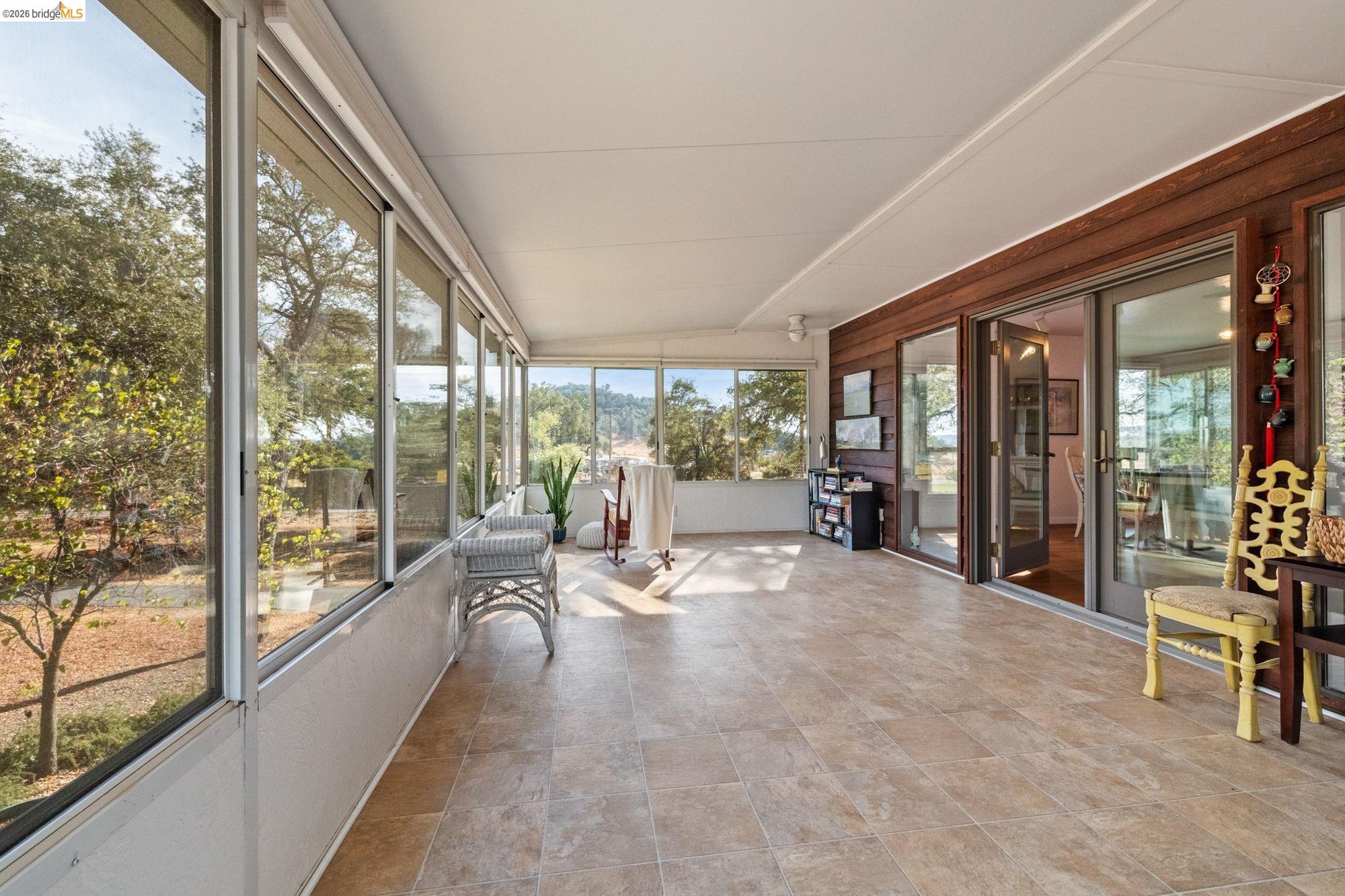 10566 Thistle Down Road Jamestown, CA 95327 - Photo 22 of 53 Unfurnished sunroom with vaulted ceiling