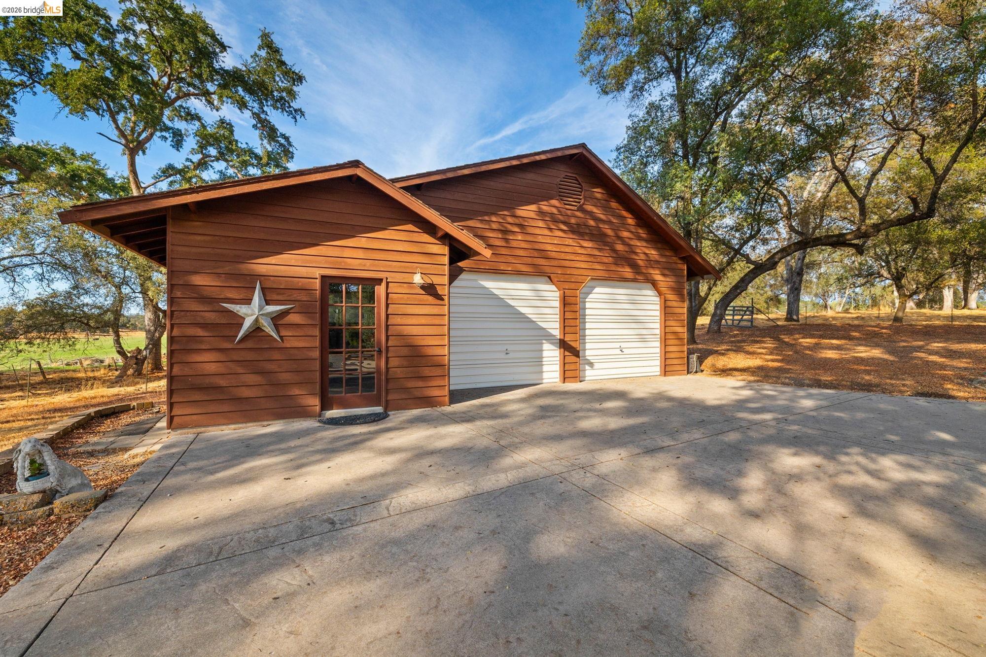 10566 Thistle Down Road Jamestown, CA 95327 - Photo 3 of 53 Garage with concrete driveway