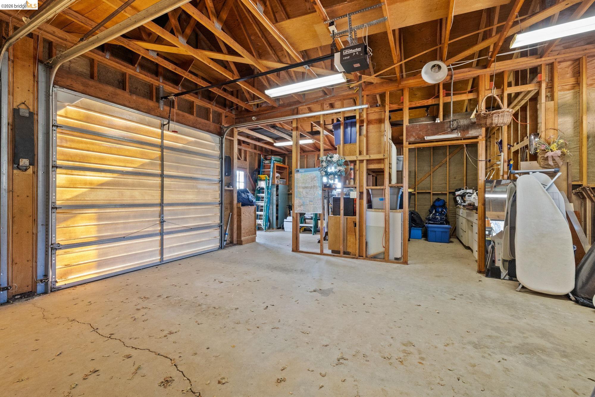 10566 Thistle Down Road Jamestown, CA 95327 - Photo 35 of 53 Garage featuring a garage door opener