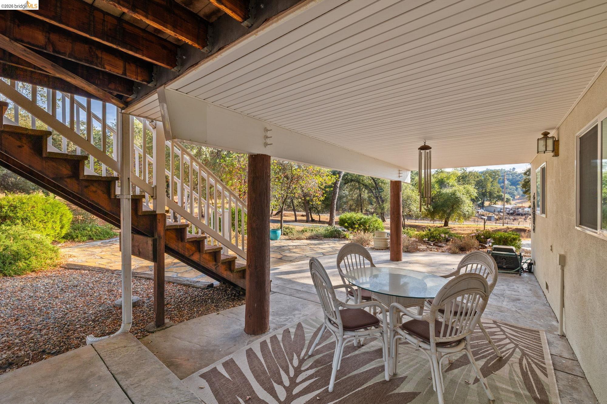 10566 Thistle Down Road Jamestown, CA 95327 - Photo 37 of 53 View of patio / terrace with stairway and outdoor dining area