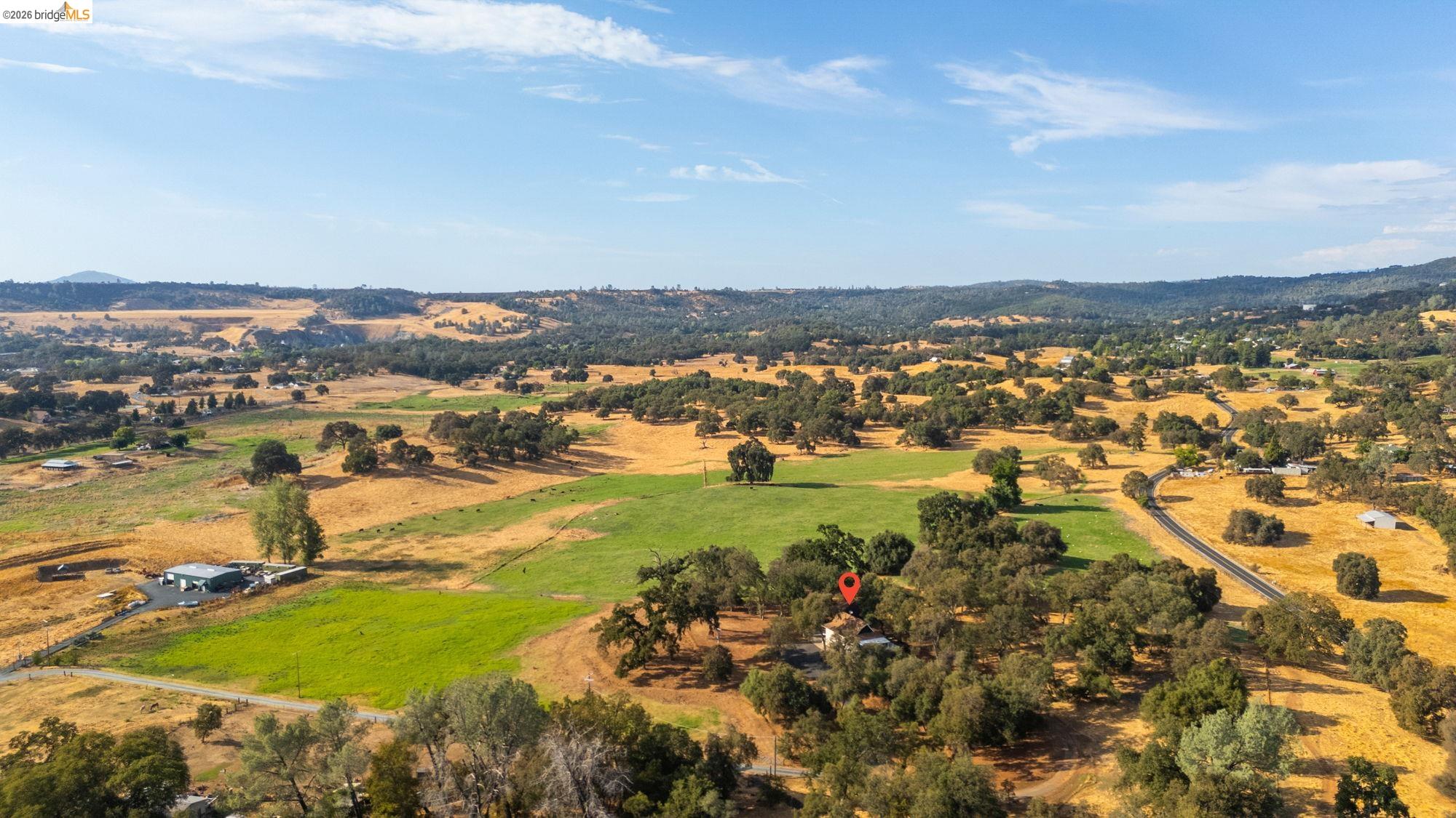 10566 Thistle Down Road Jamestown, CA 95327 - Photo 46 of 53 Overview of rural landscape featuring a mountain backdrop