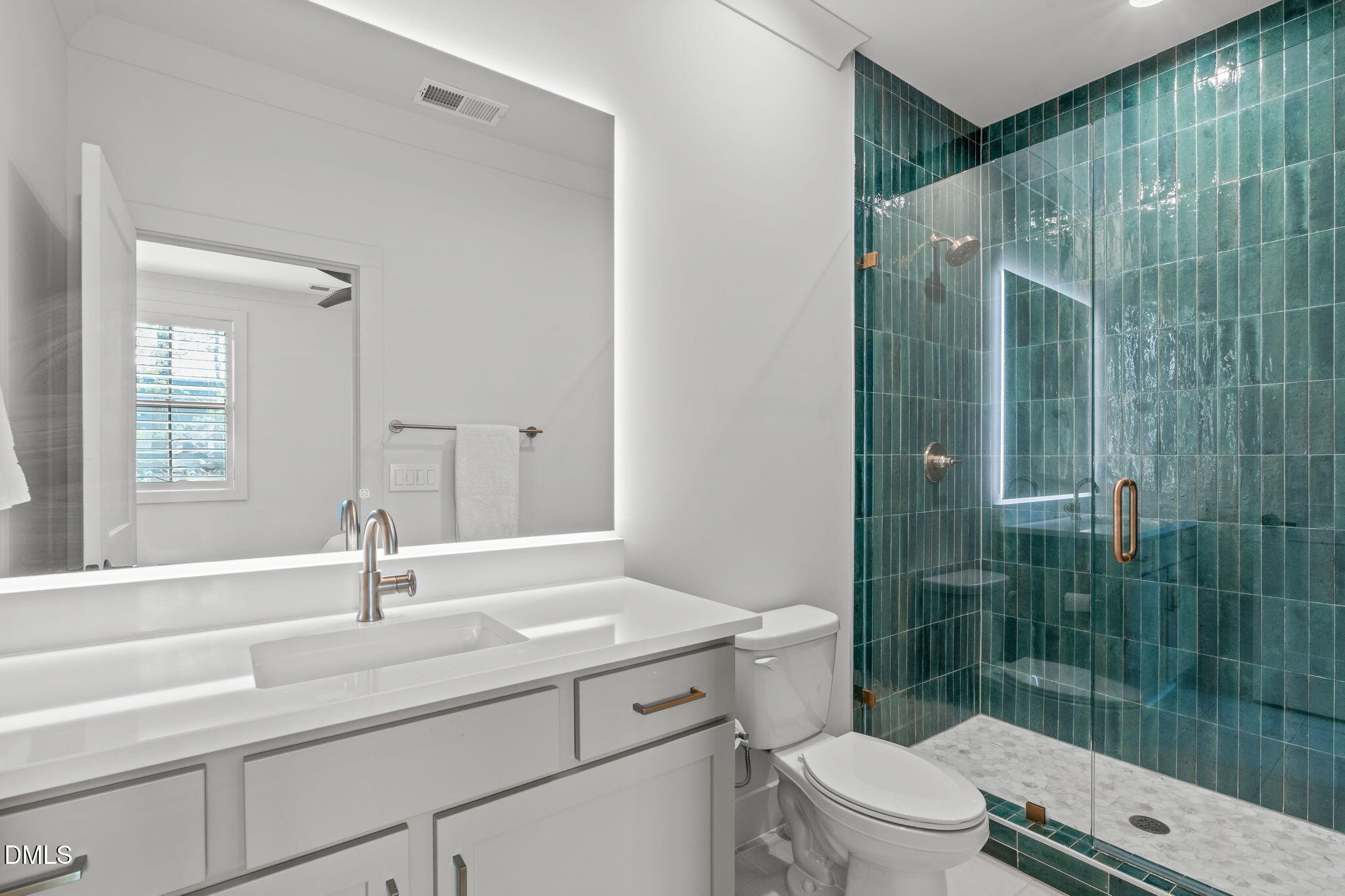 5005 Ten-Ten Road Apex, NC 27539 - Photo 26 of 60 Backlit mirror, large vanity, tile and glass shower.
