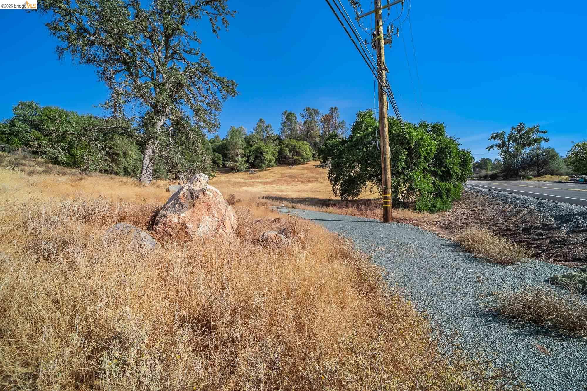 0 Sturgis Road Sonora, CA 95370 - Photo 14 of 18 a view of a yard with wooden fence