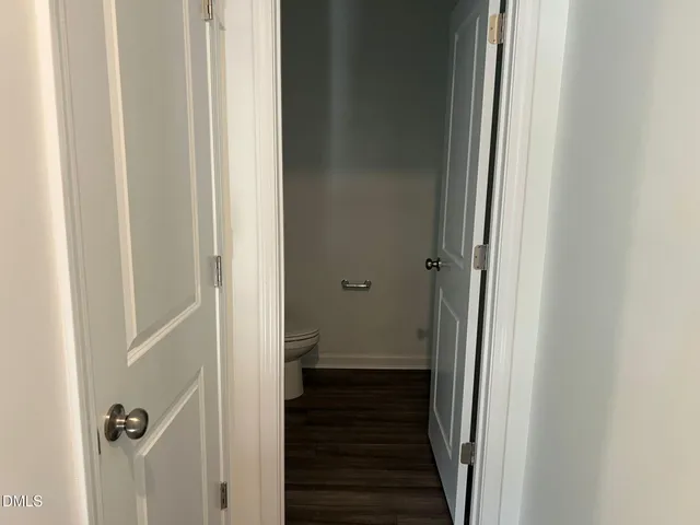 a bathroom with a sink vanity and a toilet