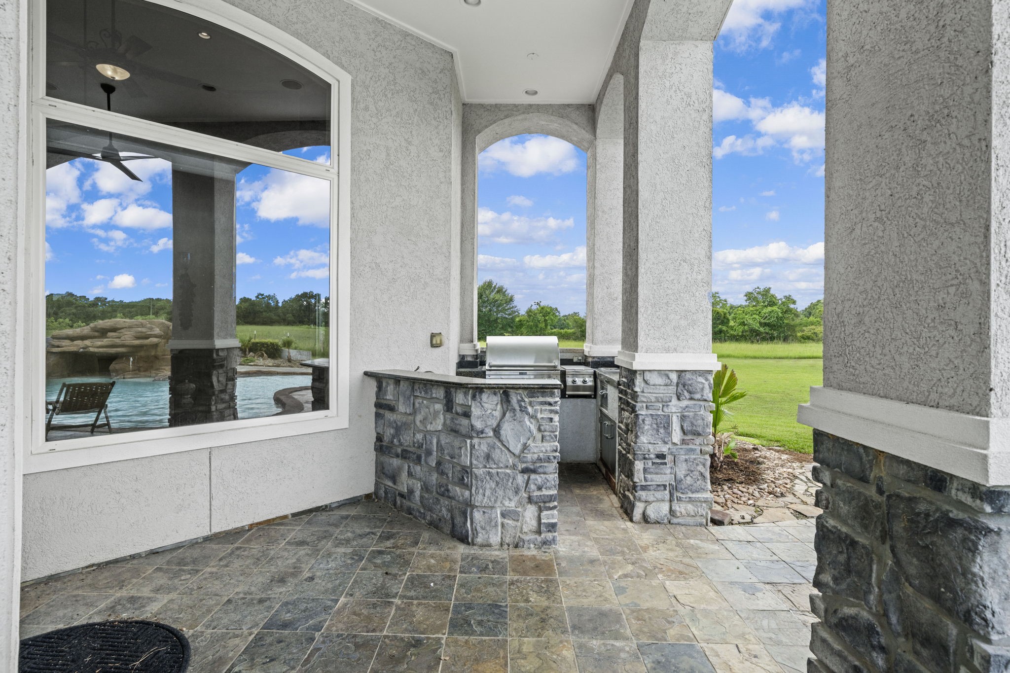 18732 Kz Road Cypress, TX 77433 - Photo 44 of 49 The perfect extension of your living space! step out onto the covered patio and enjoy seamless outdoor cooking with a high-end built-in grill.