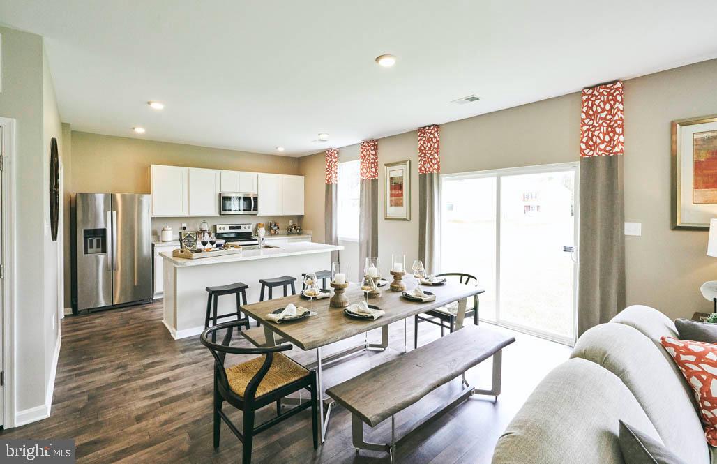 62 Buttercup Circle Elkton, MD 21921 - Photo 14 of 36 a living room with stainless steel appliances kitchen island granite countertop furniture and a kitchen view