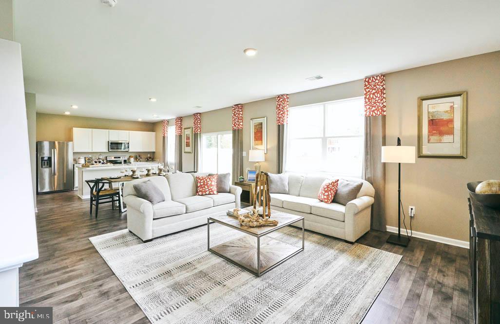 62 Buttercup Circle Elkton, MD 21921 - Photo 16 of 36 a living room with furniture kitchen view and a large window