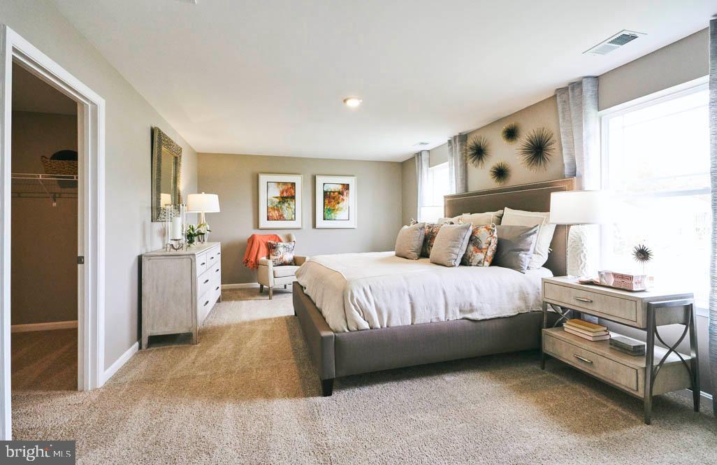 62 Buttercup Circle Elkton, MD 21921 - Photo 22 of 36 a spacious bedroom with a bed and a dresser