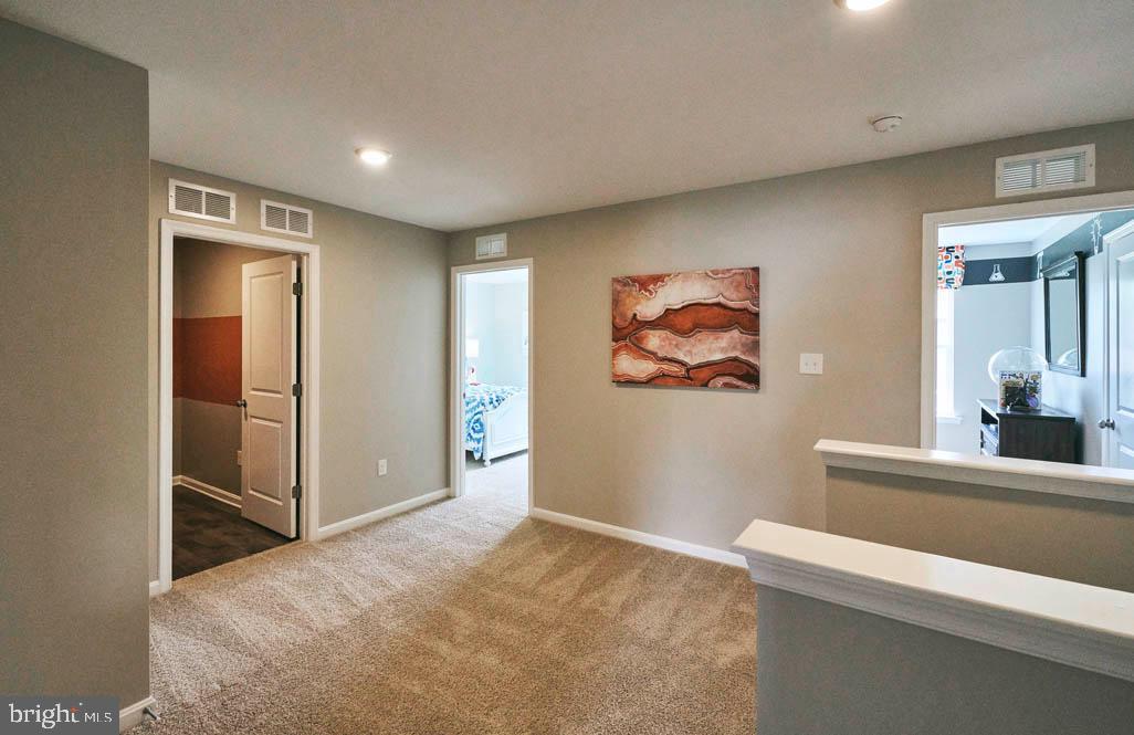 62 Buttercup Circle Elkton, MD 21921 - Photo 28 of 36 a view of a hallway with a cabinet and mirror