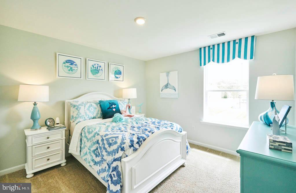62 Buttercup Circle Elkton, MD 21921 - Photo 30 of 36 a bedroom with a bed and a night stand