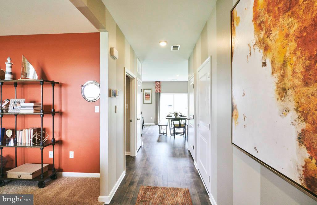 62 Buttercup Circle Elkton, MD 21921 - Photo 4 of 36 a view of a hallway with wooden floor and windows