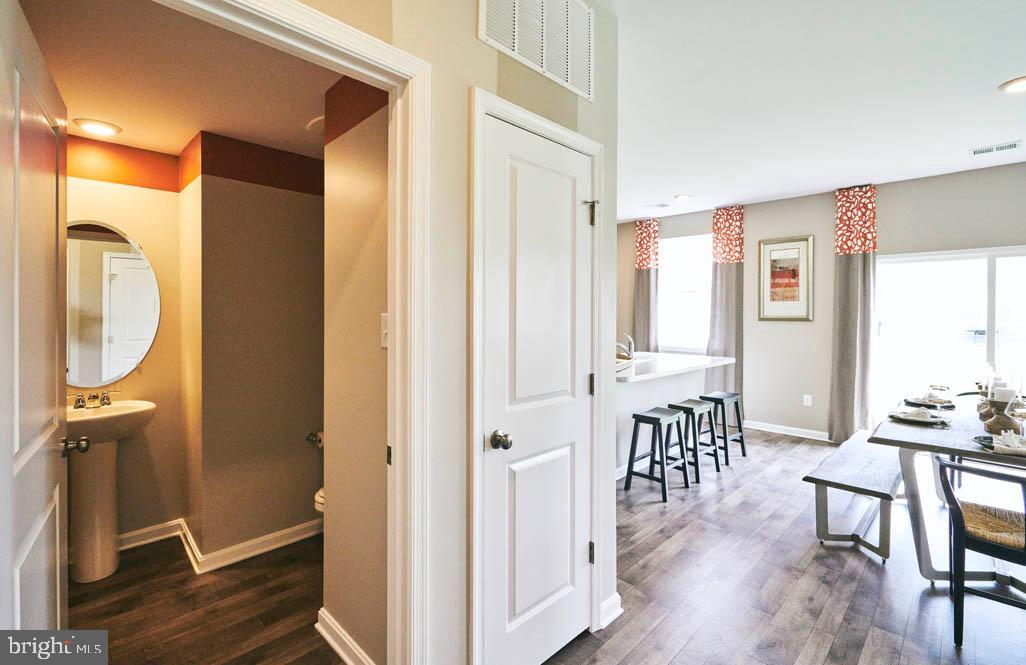 62 Buttercup Circle Elkton, MD 21921 - Photo 5 of 36 a view of a dining room with furniture window and wooden floor