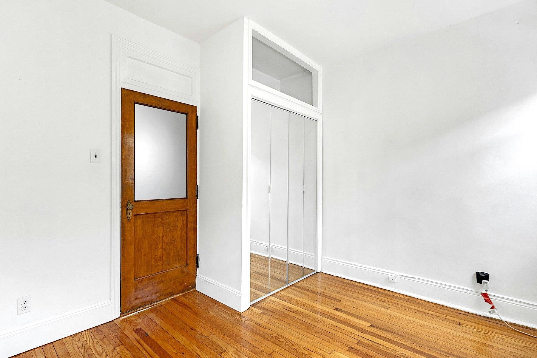 79 Madison Street, Unit 4A Hoboken, NJ 07030 - Photo 11 of 17 a view of an empty room with wooden floor