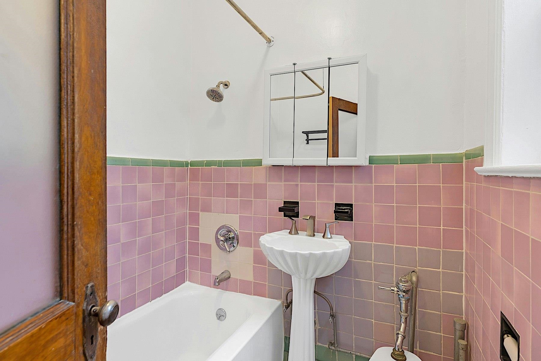 79 Madison Street, Unit 4A Hoboken, NJ 07030 - Photo 13 of 17 a bathroom with a sink and shower
