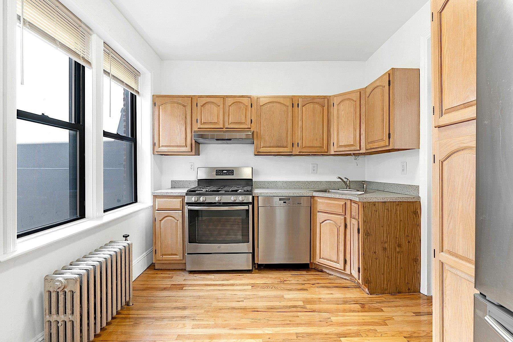 79 Madison Street, Unit 4A Hoboken, NJ 07030 - Photo 2 of 17 a kitchen with stainless steel appliances granite countertop a stove a sink and a refrigerator