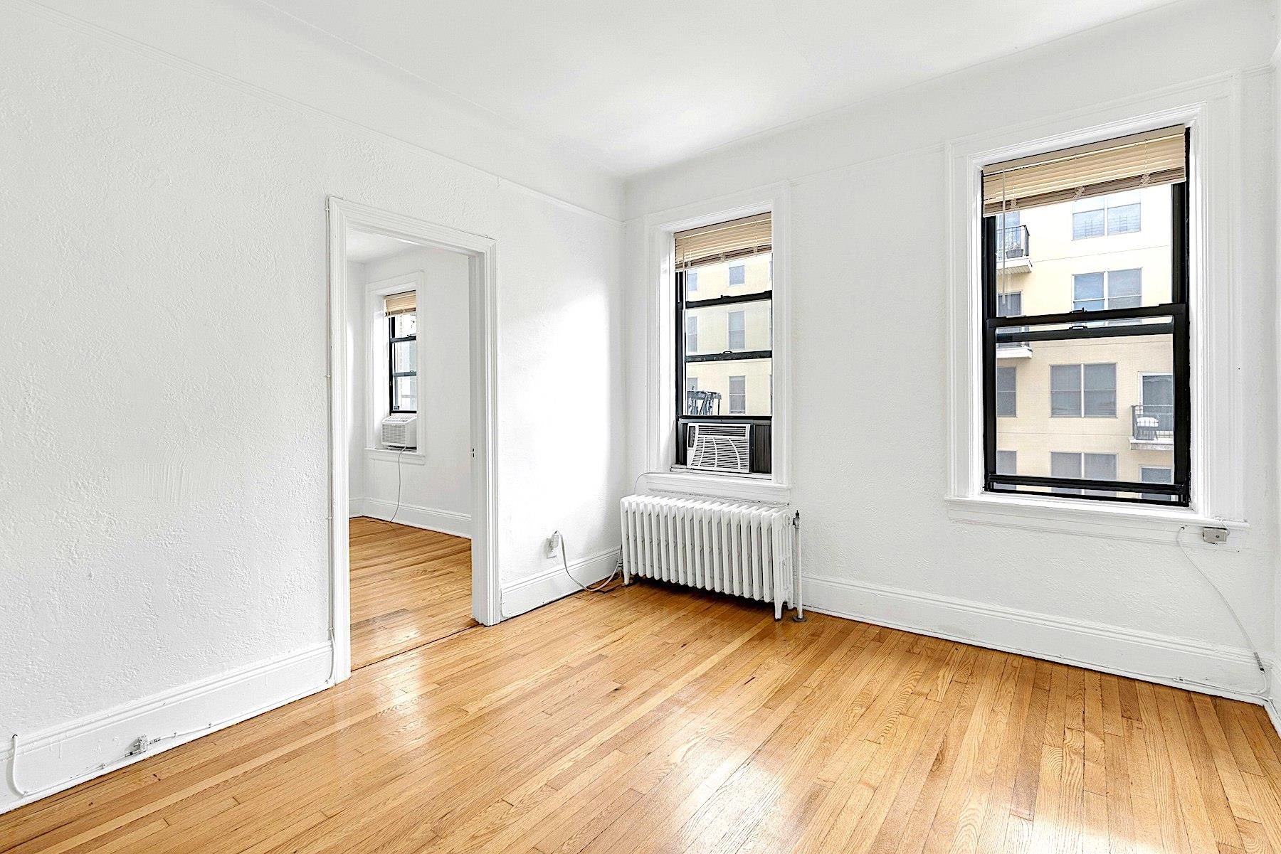 79 Madison Street, Unit 4A Hoboken, NJ 07030 - Photo 7 of 17 a view of livingroom with hardwood floor and window