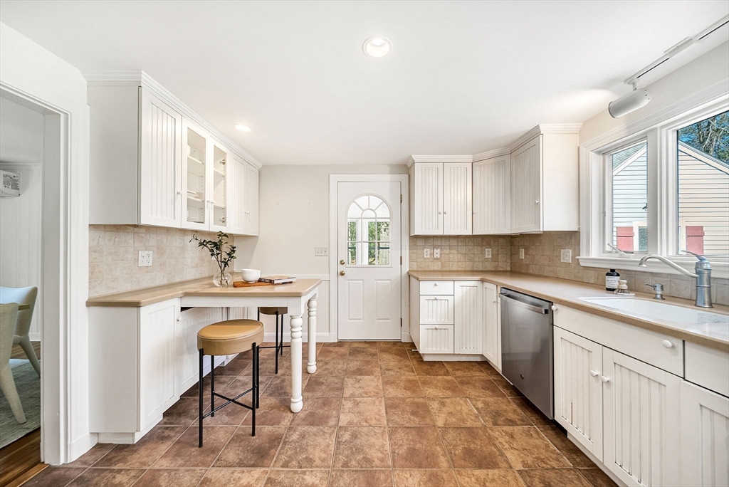 10 Bennett Road Wayland, MA 01778 - Photo 14 of 32 a kitchen with a sink cabinets and window