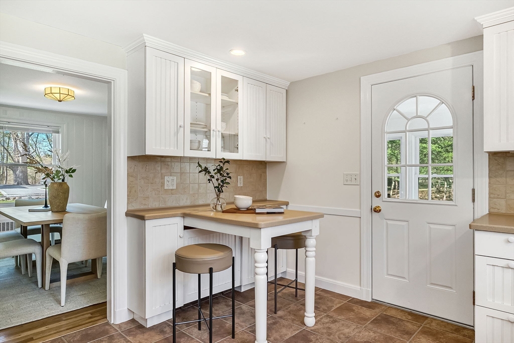 10 Bennett Road Wayland, MA 01778 - Photo 16 of 32 a view of a kitchen area with furniture and wooden floor
