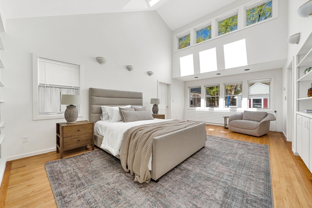 10 Bennett Road Wayland, MA 01778 - Photo 18 of 32 a spacious bedroom with a bed and a couch