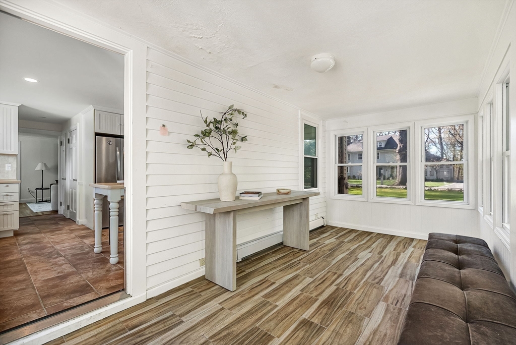 10 Bennett Road Wayland, MA 01778 - Photo 24 of 32 a view of a living room and kitchen with a large window