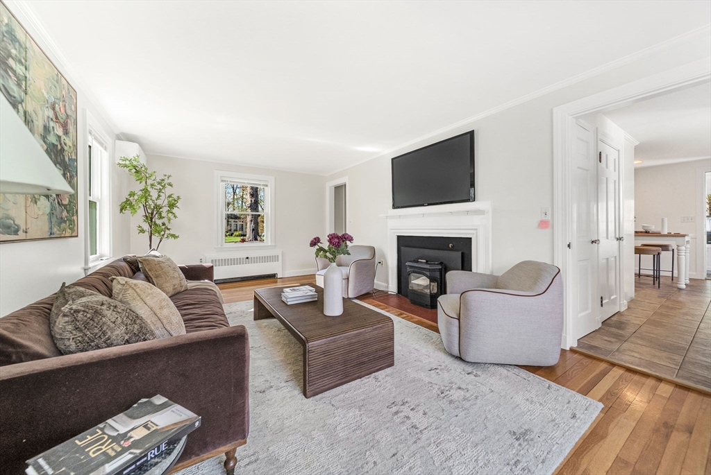 10 Bennett Road Wayland, MA 01778 - Photo 6 of 32 a living room with furniture and a fireplace