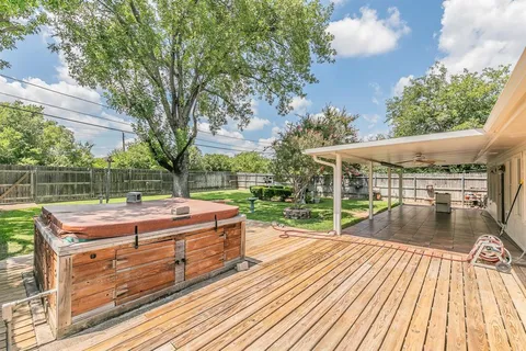 a view of a backyard with sitting area