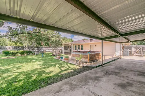 a view of a porch with a big yard