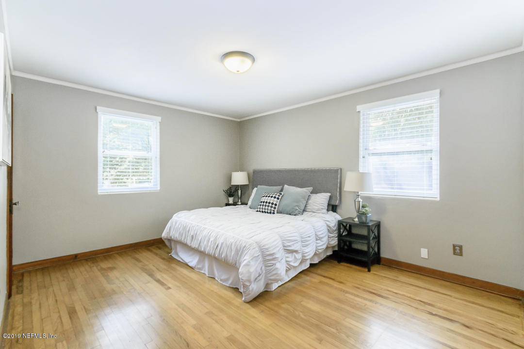 1816 Lorimier Road Jacksonville, FL 32207 - Photo 13 of 25 a bedroom with a bed and a window