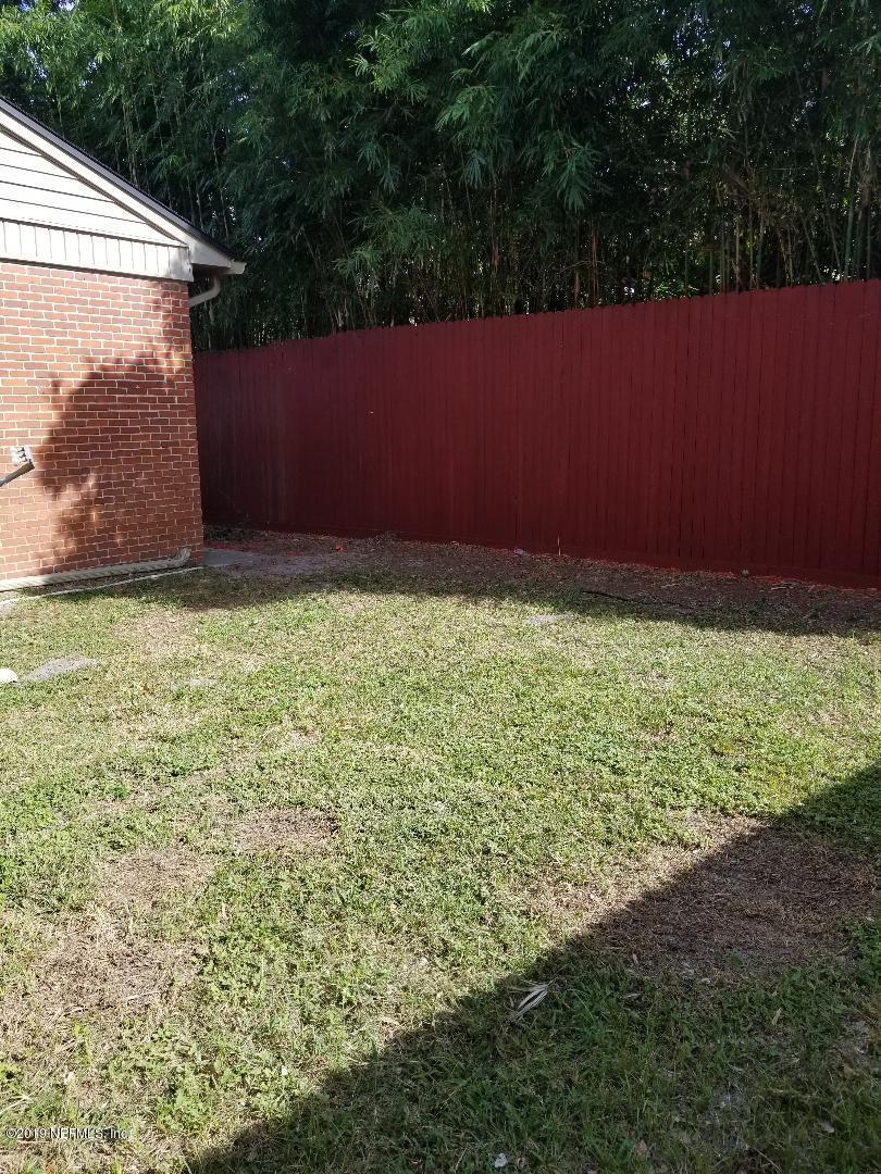 1816 Lorimier Road Jacksonville, FL 32207 - Photo 23 of 25 a backyard of a house with lots of green space