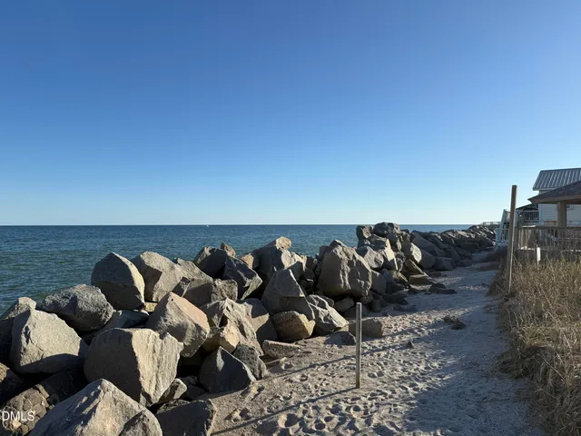 a view of a balcony with furniture