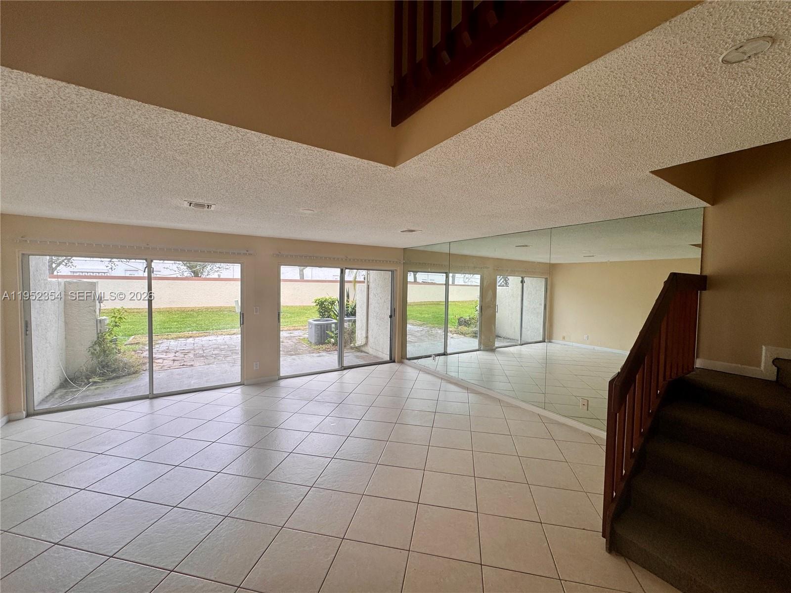 4879 North Hemingway Circle Margate, FL 33063 - Photo 16 of 44 a view of an empty room with windows