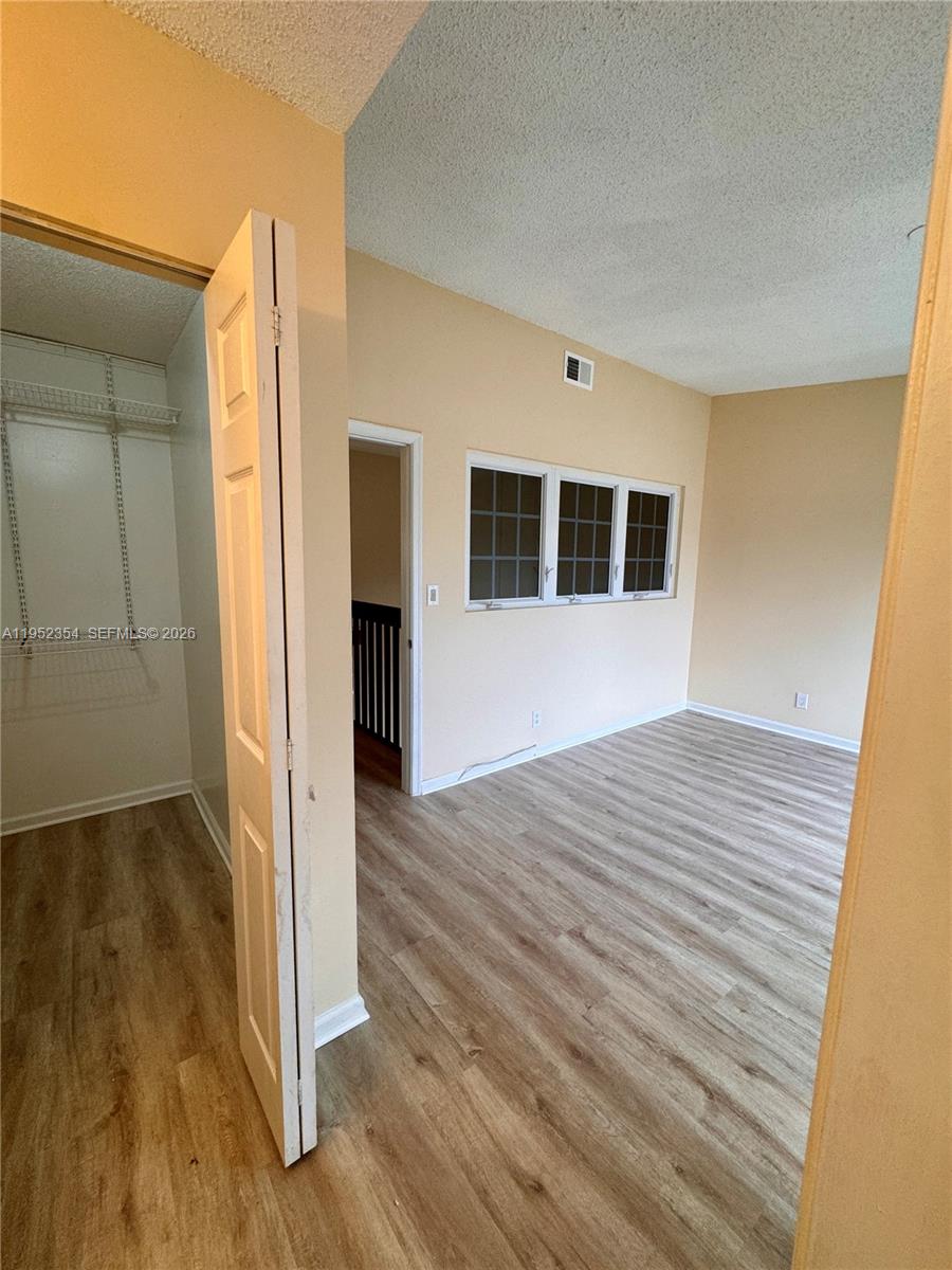 4879 North Hemingway Circle Margate, FL 33063 - Photo 21 of 44 a view of empty room with wooden floor