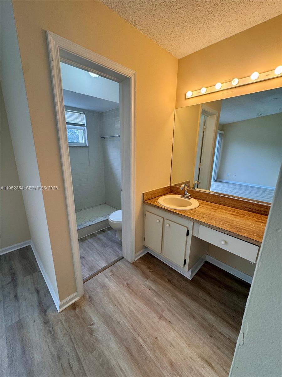 4879 North Hemingway Circle Margate, FL 33063 - Photo 23 of 44 a room with wooden floor and furniture