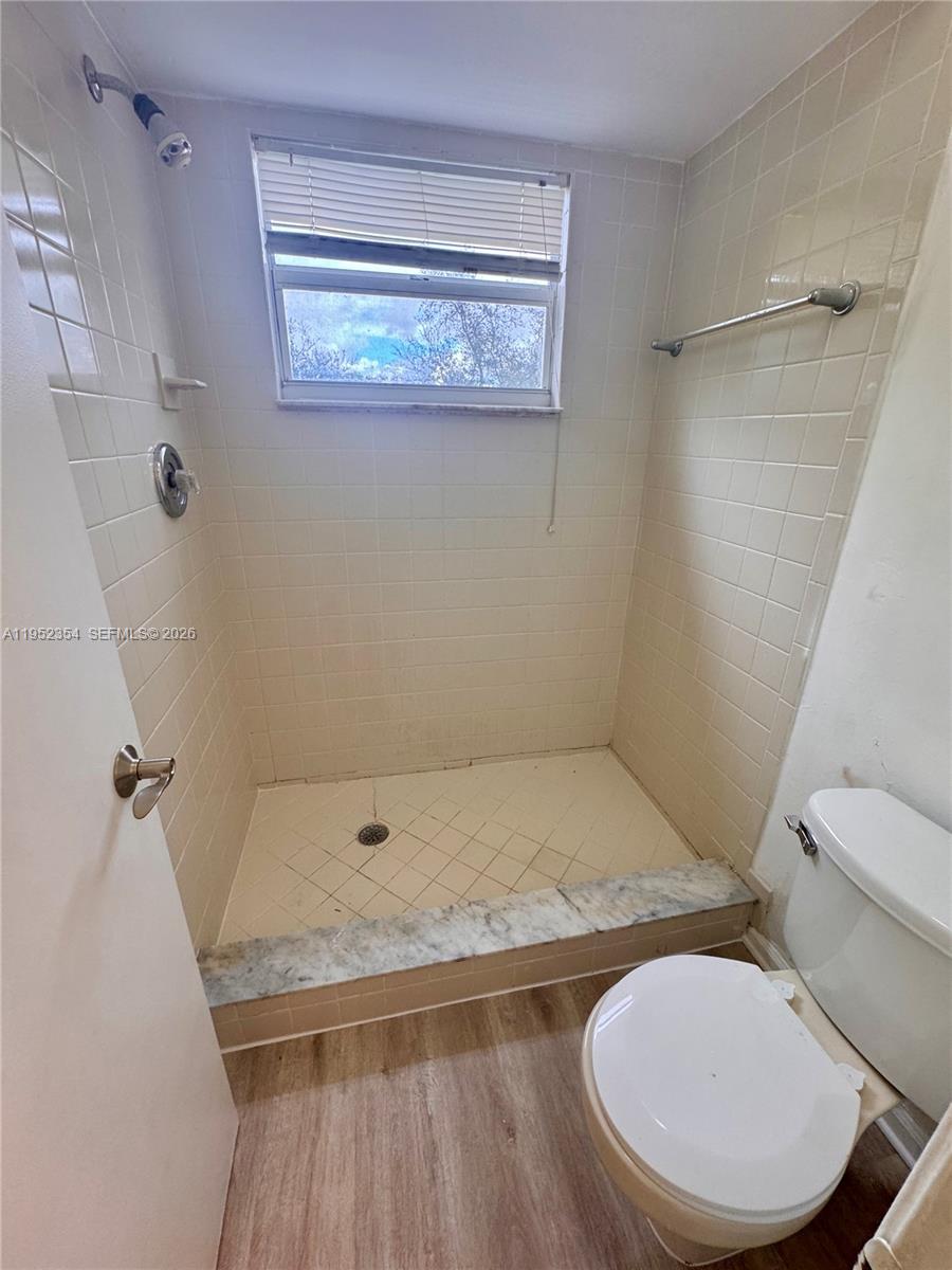 4879 North Hemingway Circle Margate, FL 33063 - Photo 25 of 44 a bathroom with a toilet and a shower