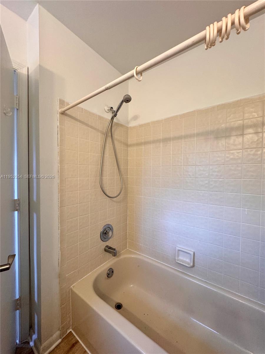 4879 North Hemingway Circle Margate, FL 33063 - Photo 33 of 44 a bathroom with a bath tub with a shower