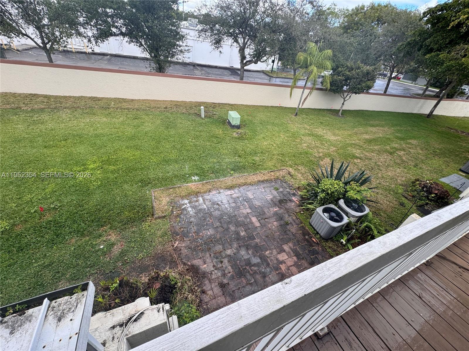 4879 North Hemingway Circle Margate, FL 33063 - Photo 35 of 44 a view of a garden with an outdoor space