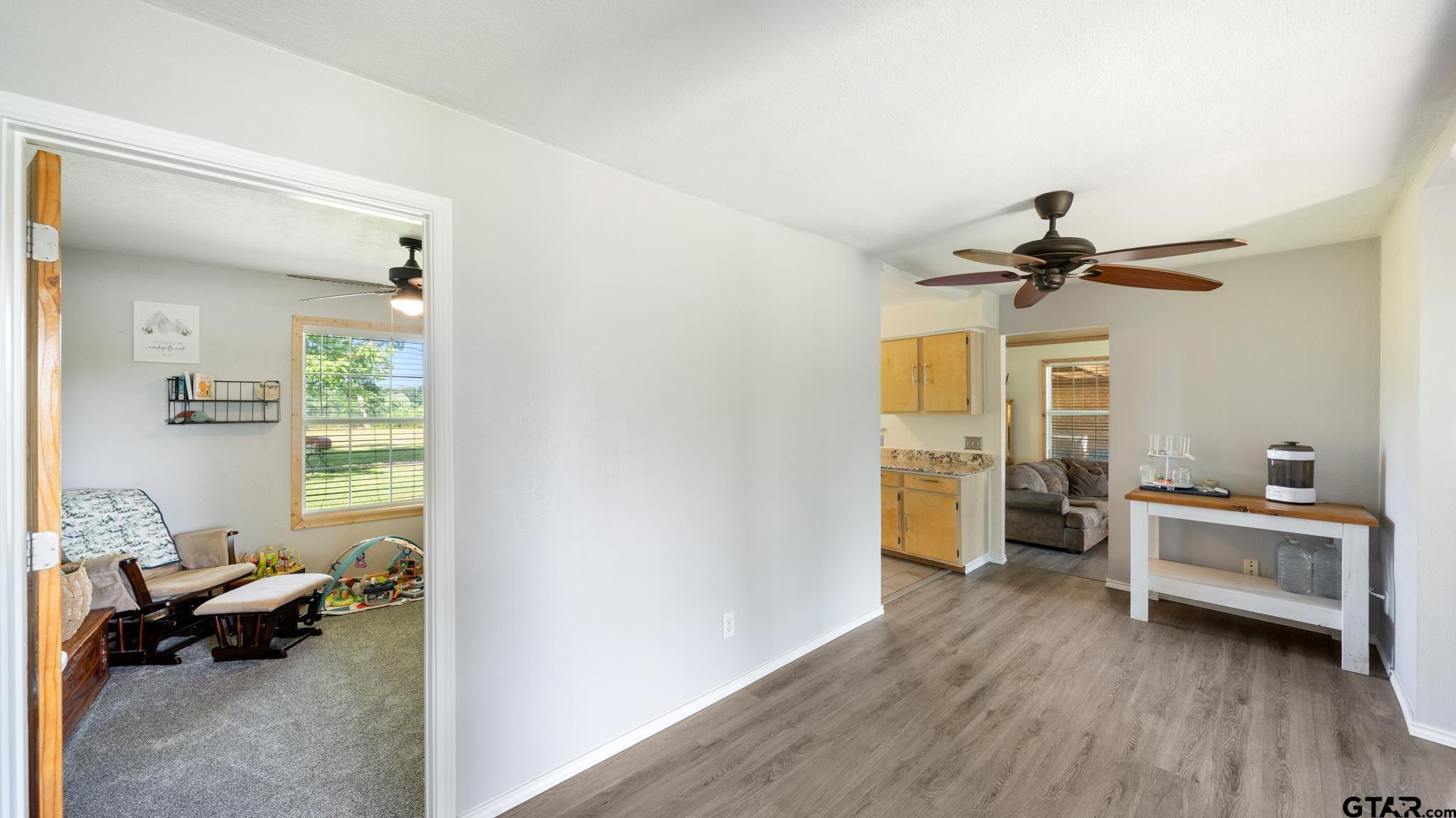 29080 Highway 19 Athens, TX 75752 - Photo 13 of 30 a living room with furniture and a chandelier