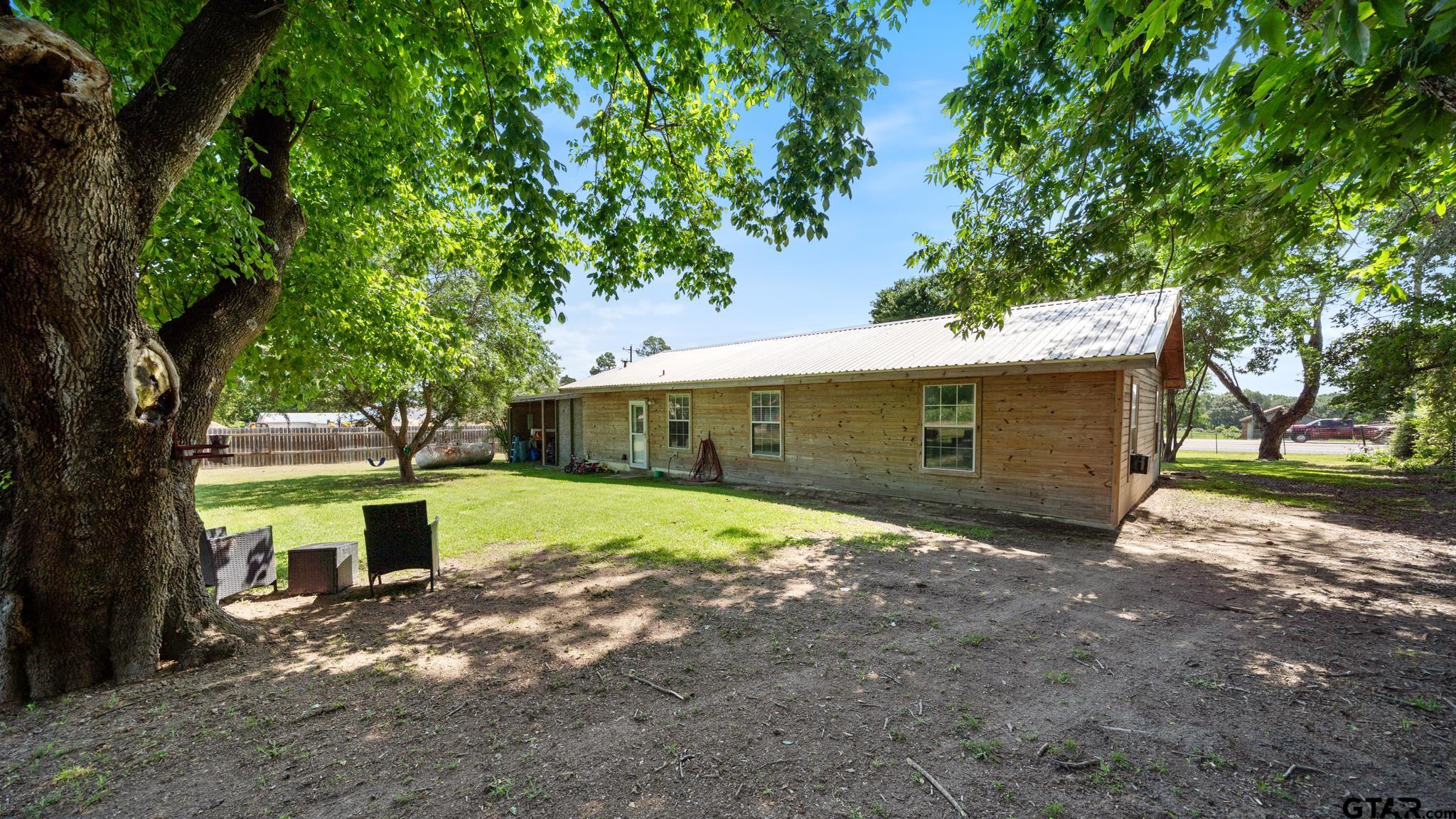 29080 Highway 19 Athens, TX 75752 - Photo 22 of 30 a front view of a house with a yard and garage