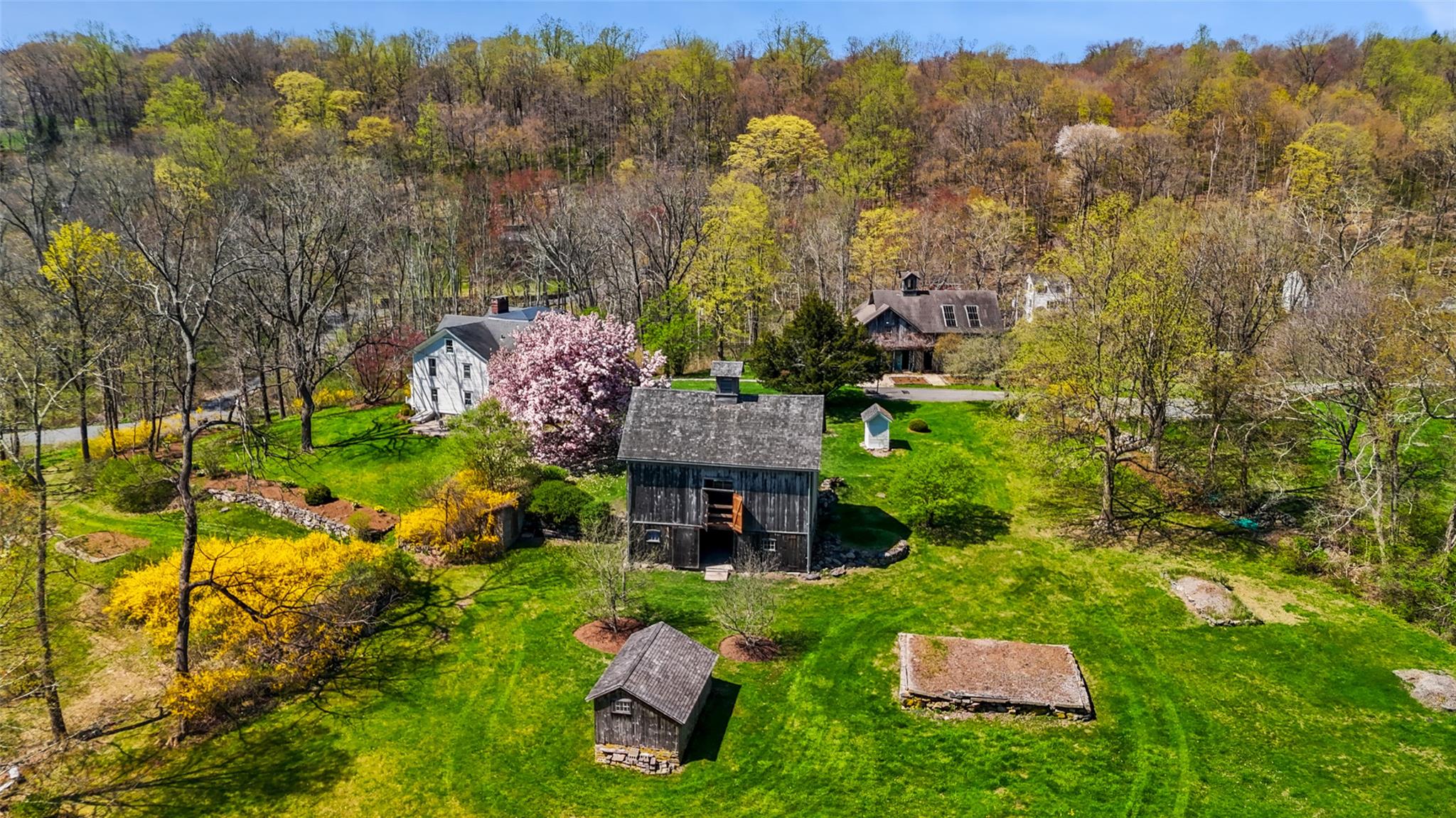 an aerial view of a house with yard swimming pool and mountain view