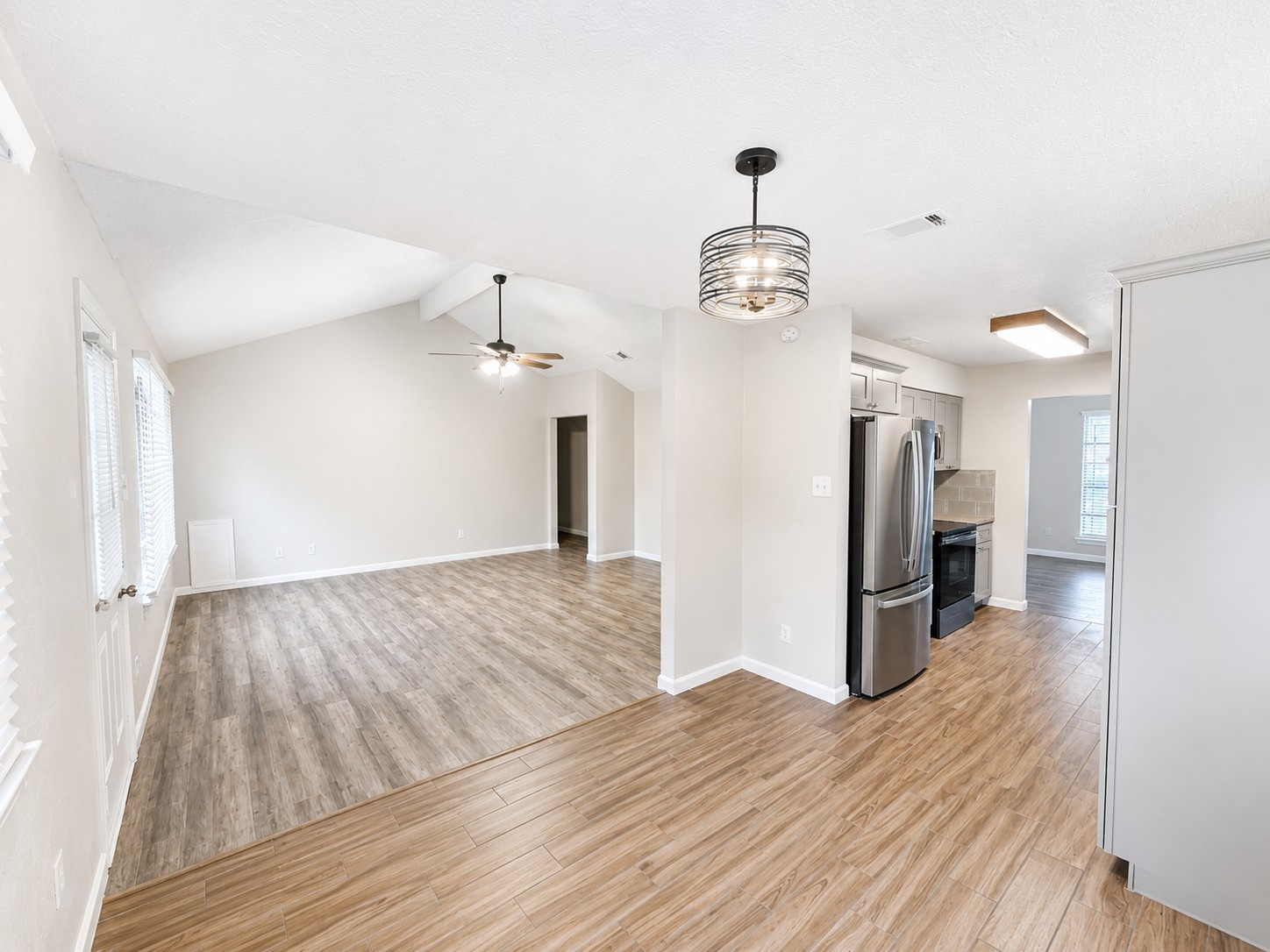 15950 Chimney Rock Road Missouri City, TX 77489 - Photo 7 of 9 a view of a livingroom with wooden floor