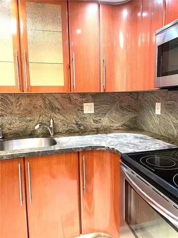 a kitchen with a sink and a window