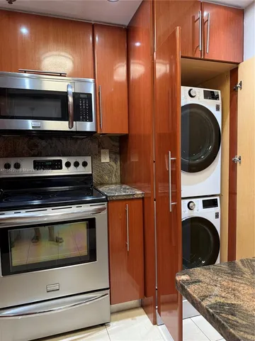 a kitchen with a stove and a microwave