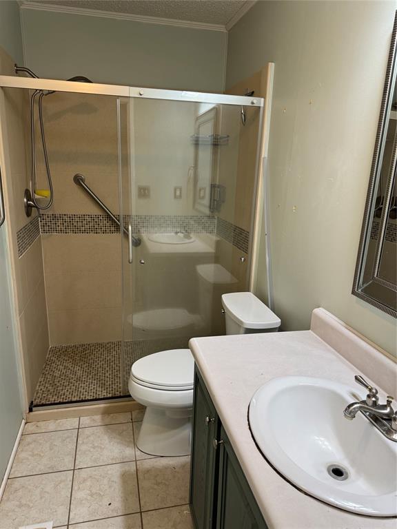 220 Robinson Road Elm Grove, LA 71051 - Photo 12 of 22 a bathroom with a sink a toilet and shower
