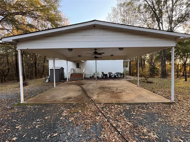 a view of a house with a backyard