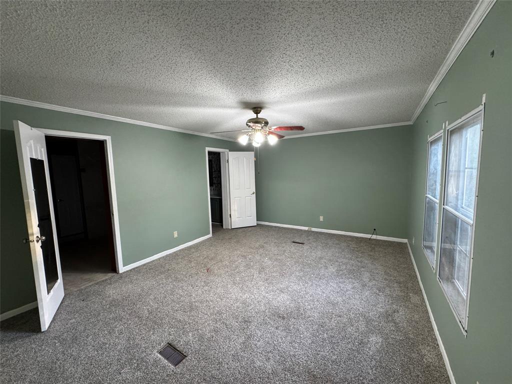 220 Robinson Road Elm Grove, LA 71051 - Photo 7 of 22 wooden floor in an empty room with a window