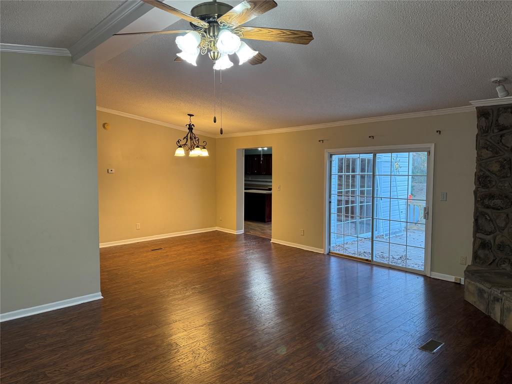 220 Robinson Road Elm Grove, LA 71051 - Photo 9 of 22 a view of an empty room with wooden floor and a window