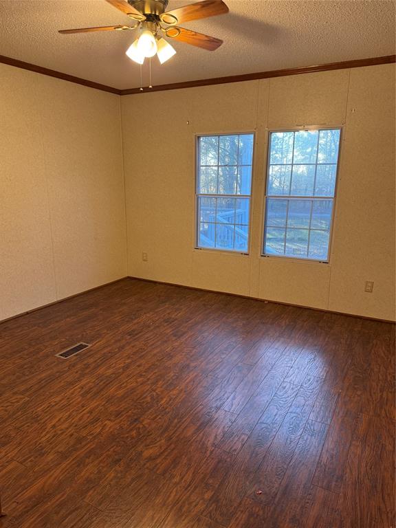 220 Robinson Road Elm Grove, LA 71051 - Photo 10 of 22 a view of an empty room with wooden floor and a window