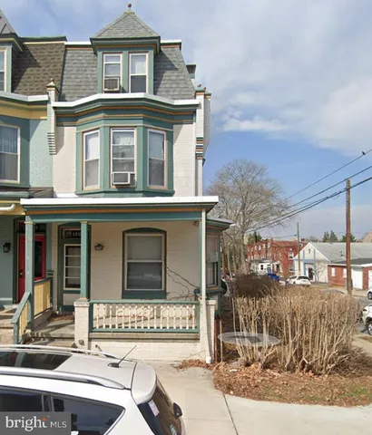 front view of a house with a street
