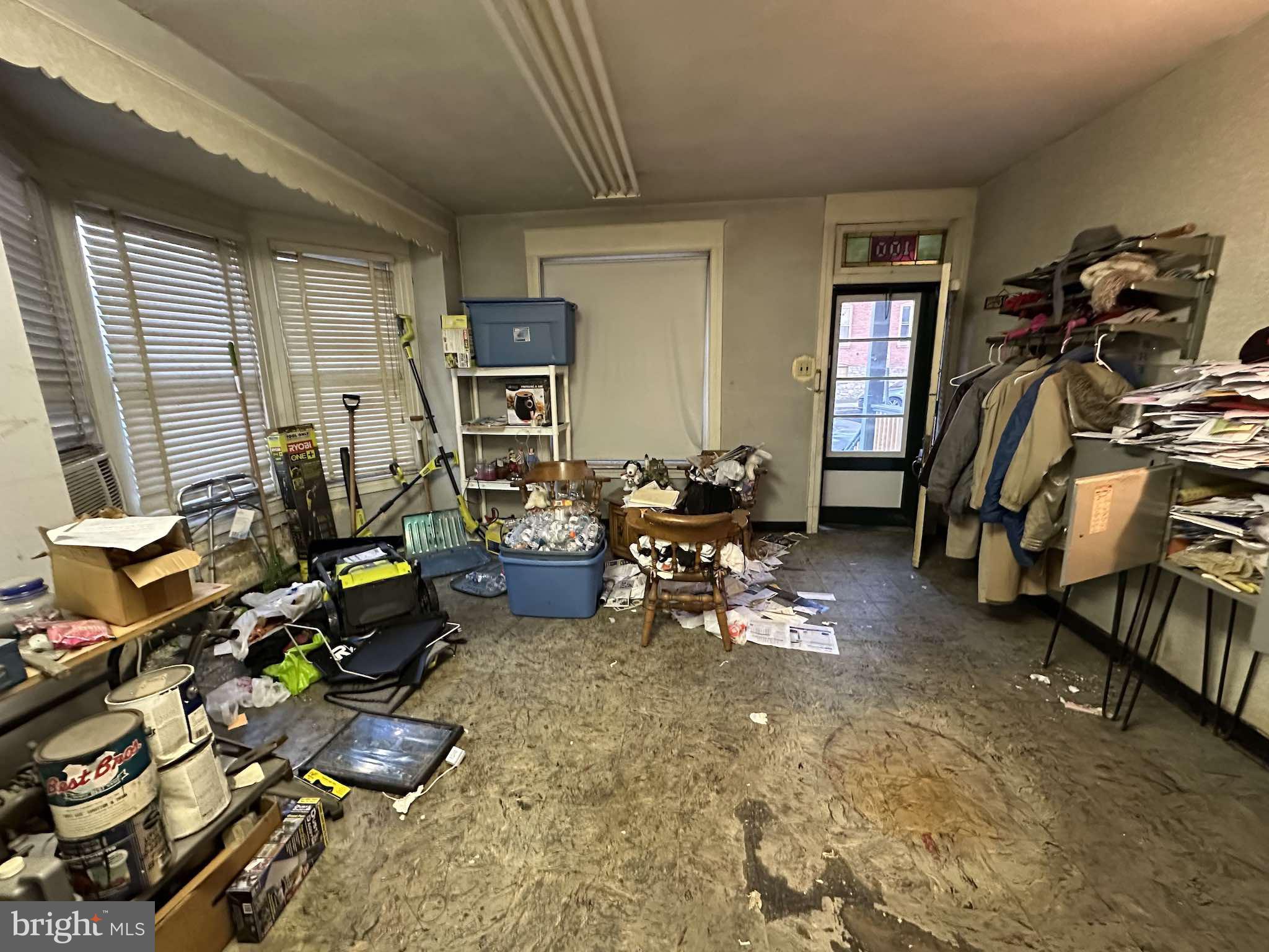 100 South 6th Avenue Reading, PA 19611 - Photo 3 of 19 a living room filled with furniture gym equipment and a window