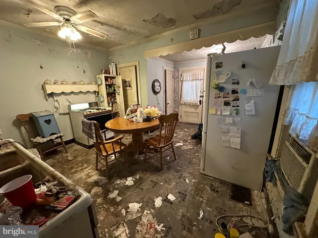 a dining room filled with furniture and a chandelier